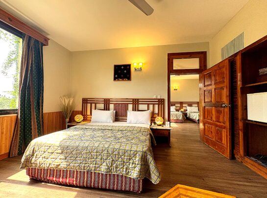 Spacious family suite with double bed and mountain view at Rock City Resort Swat