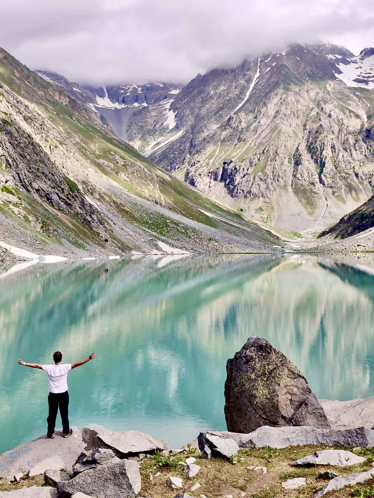 Scenic lake in Swat Valley, Pakistan with crystal clear water and mountains