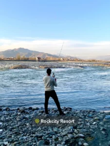 Fishing area at Rock City Resort Swat with guest enjoying trout fishing
